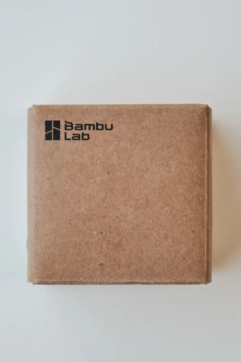 Kraft paper packaging box with Bambu Lab logo printed on the top left corner