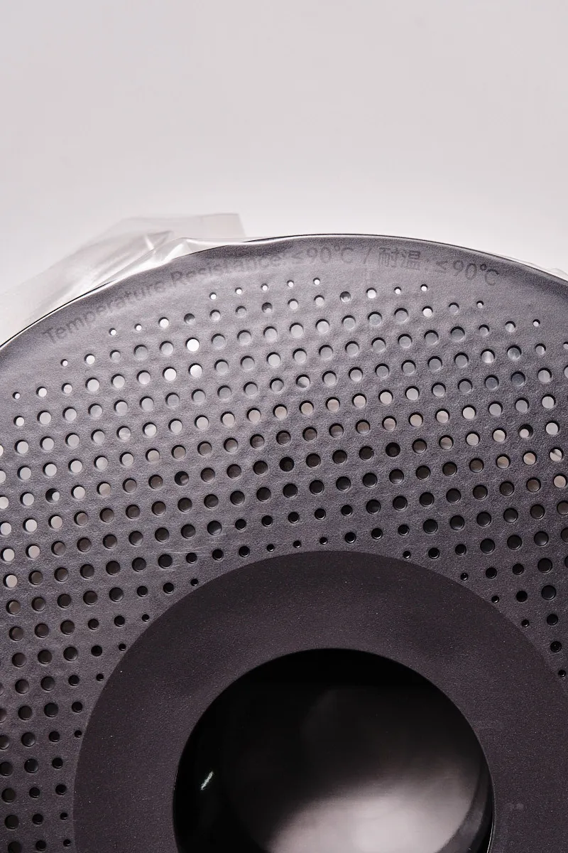 Close-up of the upper rim of a Bambu Lab filament spool showing the "Temperature Resistance &le; 90&deg;C" warning in English and Chinese.