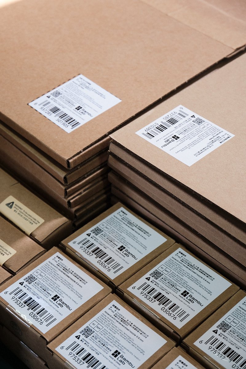 Composite image divided into four sections showing 3D printer build plates in the upper right area and hotend components in the lower sections