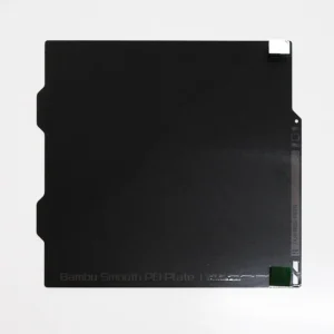 Top-down view of the FAP008 Bambu smooth PEI build plate showing the green peel-off protective film marker in the top-right corner