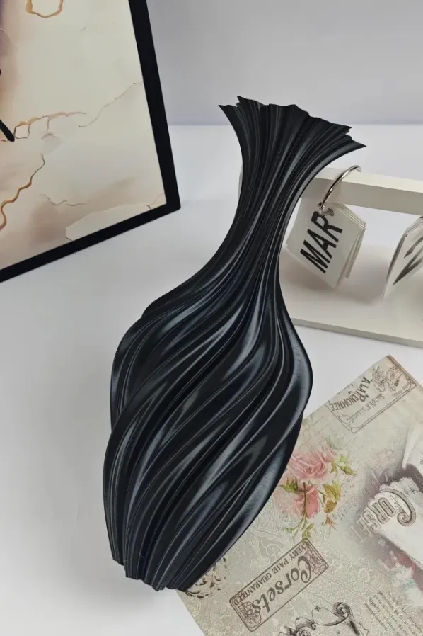 Bambu Lab PLA Basic Black filament 3D printed vase with twisted vertical grooves