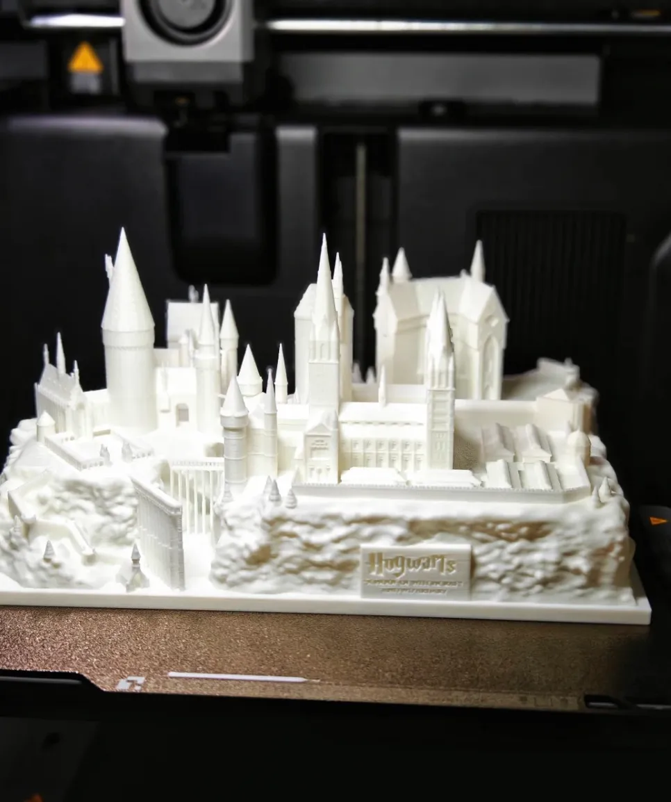 PLA Basic Jade White filament 3D printed castle-style architectural model on a printer build plate