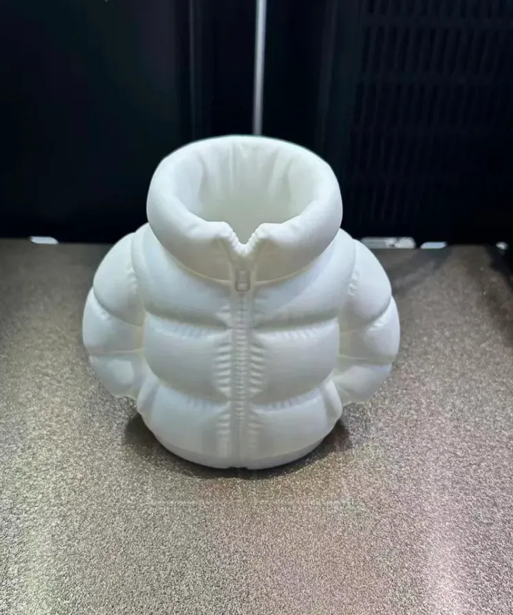 PLA Basic Jade White filament 3D printed jacket-shaped model on a printer build plate