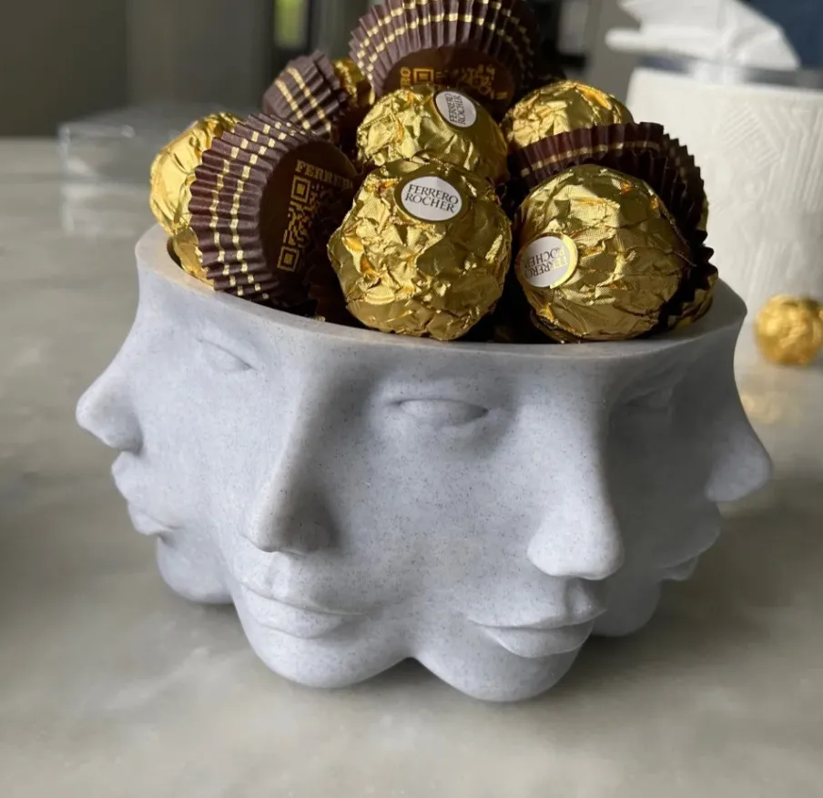 Multi-face head container 3D printed with PLA Marble filament 13103 filled with chocolates