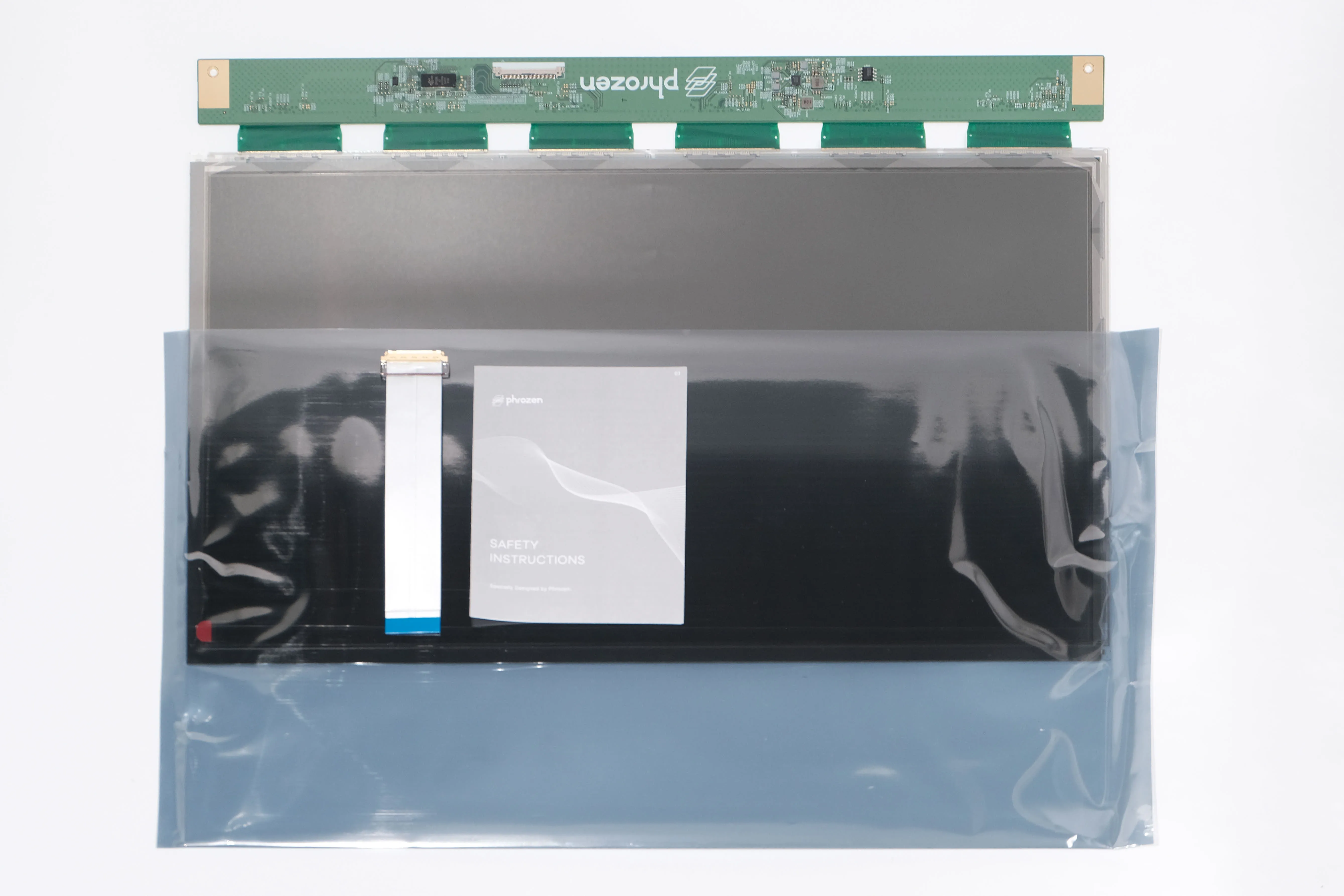 Phrozen Sonic Mega 8K / 8KS / 8K V2 LCD screen in protective bag, flat lay view with ribbon cable and user guide