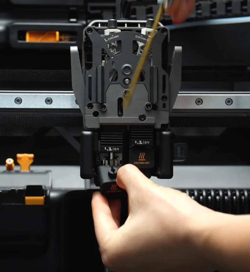 Using a tool to assist in removing a quick swap nozzle from a Bambu Lab hotend