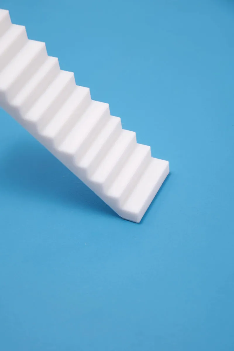 Close-up of 3D-printed white tilted stair first step adhered to blue cold build plate, showing strong adhesion on small contact area