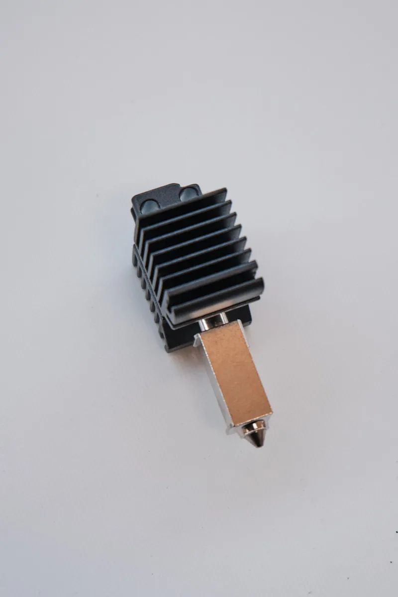 Side profile of Bambu Lab hotend featuring a 0.6mm hardened steel nozzle and integrated radiator fins
