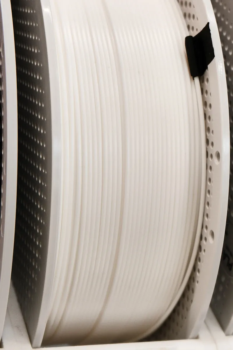 Side view of Bambu PLA Basic jade white 10100 filament spool showing smooth white filament