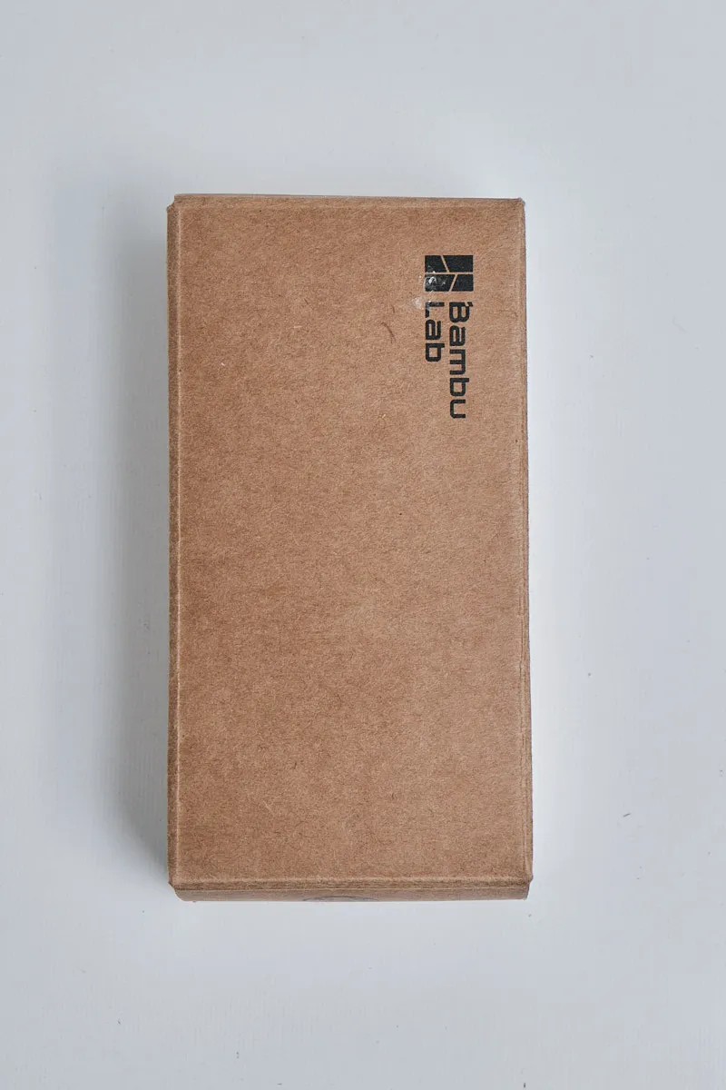 Original brown cardboard packaging box with Bambu Lab logo for P1 series spare parts