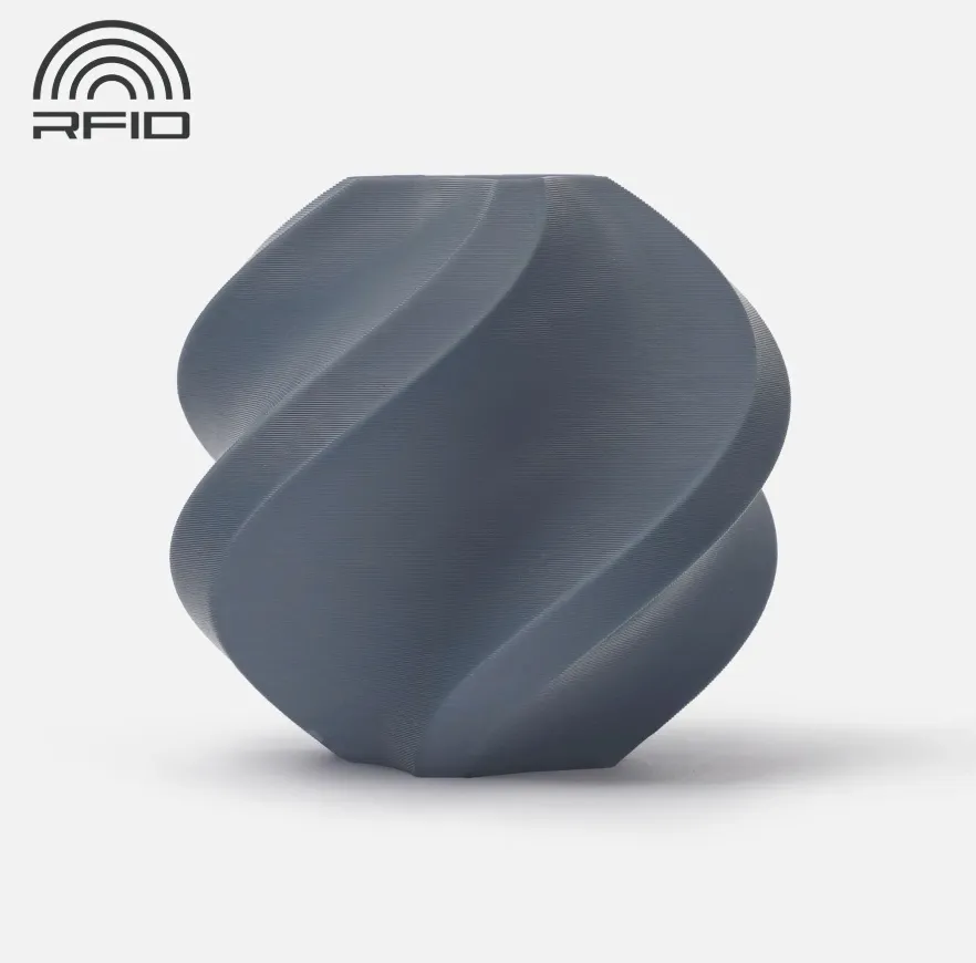 The printed sample demonstrates the color neutrality, surface smoothness, and consistent print quality achievable with Bambu Lab PLA Basic Blue Grey filament.