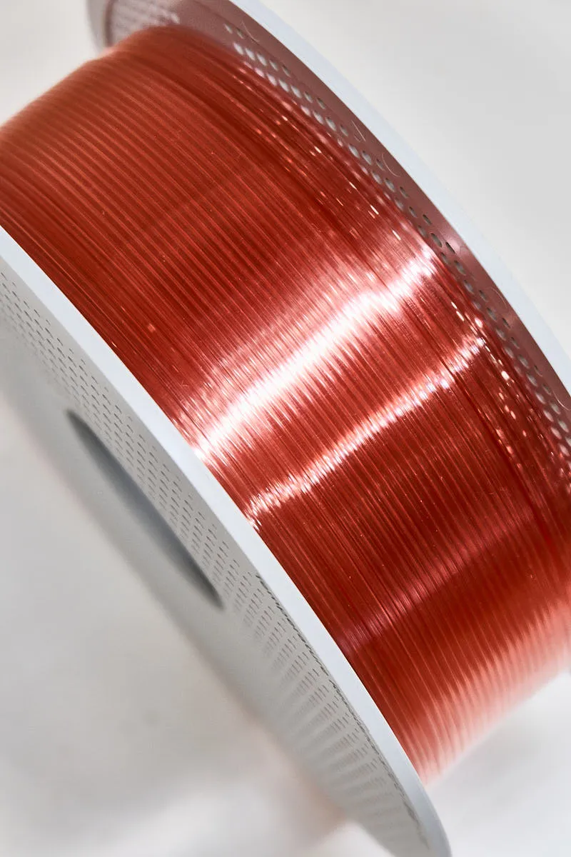 Close-up of Bambu Lab PETG Translucent Pink filament on spool showing glossy translucent texture, color code 32200