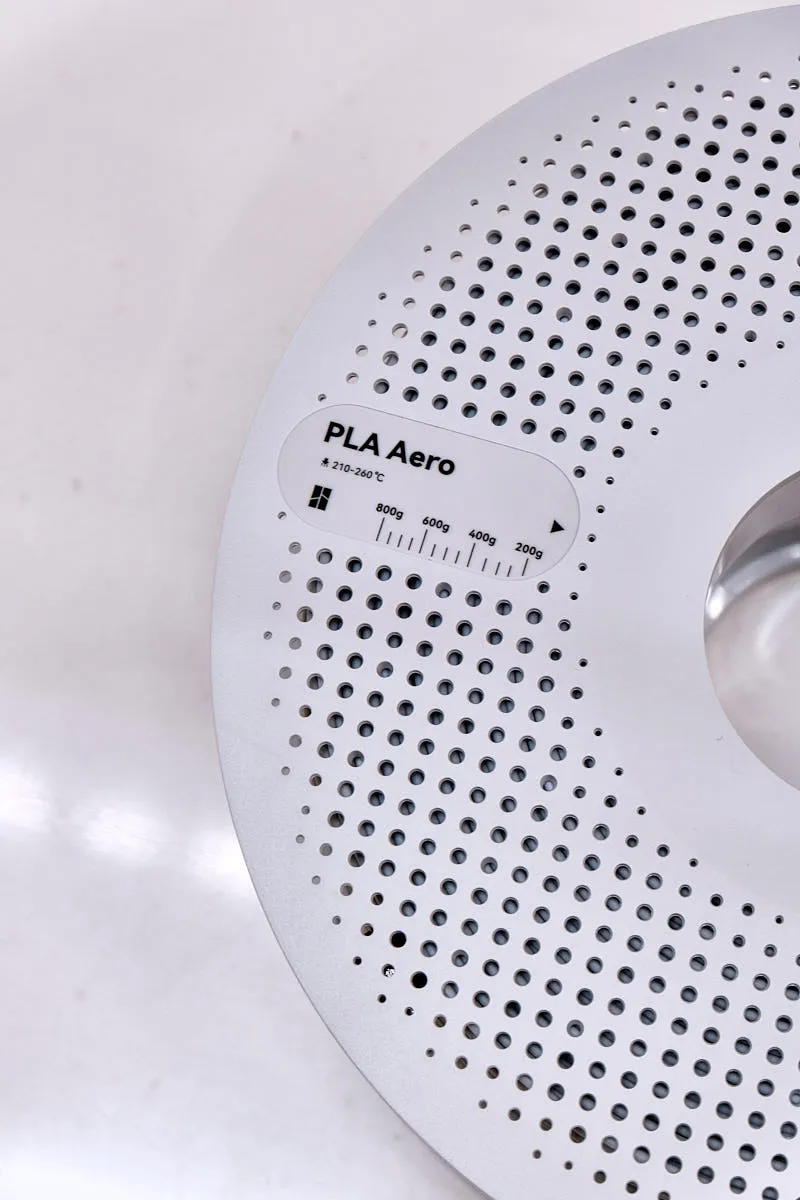 Close-up of Bambu Lab PLA Aero gray filament spool label showing foaming PLA material and color code 14104