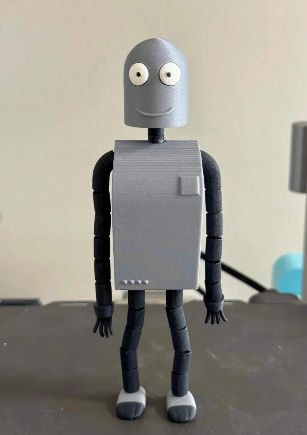 Articulated figure printed with Bambu Lab PLA-CF Lava Gray filament 14101, featuring precise joints, smooth matte surface, and high structural rigidity