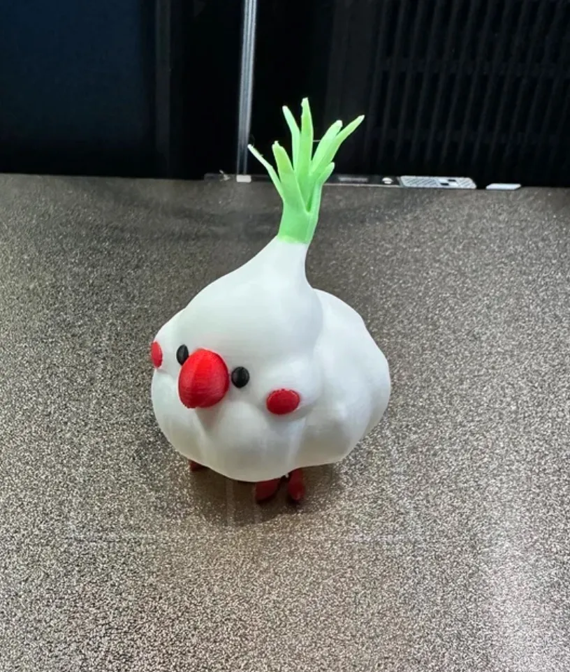 Cute character figurine 3D printed with Bambu Lab PLA Glow Green filament 15500 showing smooth surface and playful details under normal lighting