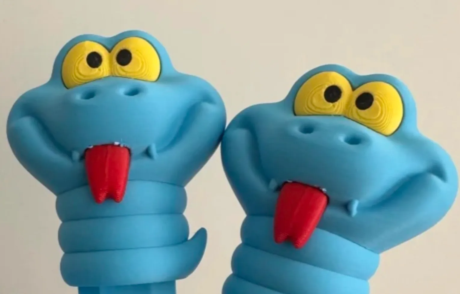 Multi-color cartoon character printed with Bambu Lab PLA Lite Cyan filament, showing smooth surface transitions, clean color separation, and lightweight PLA structure