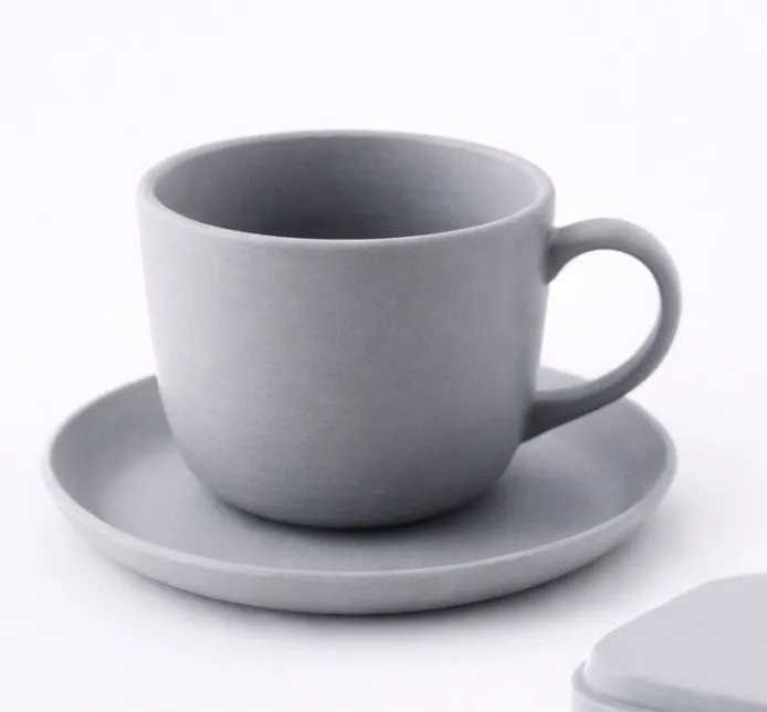 Matte gray coffee cup and saucer 3D printed with Bambu Lab PLA Matte Filament 11102, showing smooth surface and soft industrial aesthetic