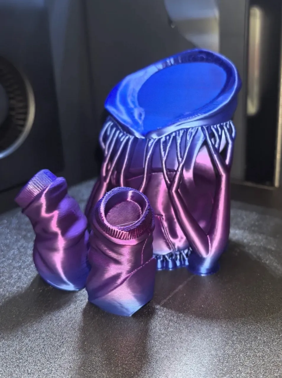 Iridescent container 3D printed with Bambu Lab PLA Silk Aurora Purple Filament 13909, showing metallic purple and blue color shift with glossy silk finish