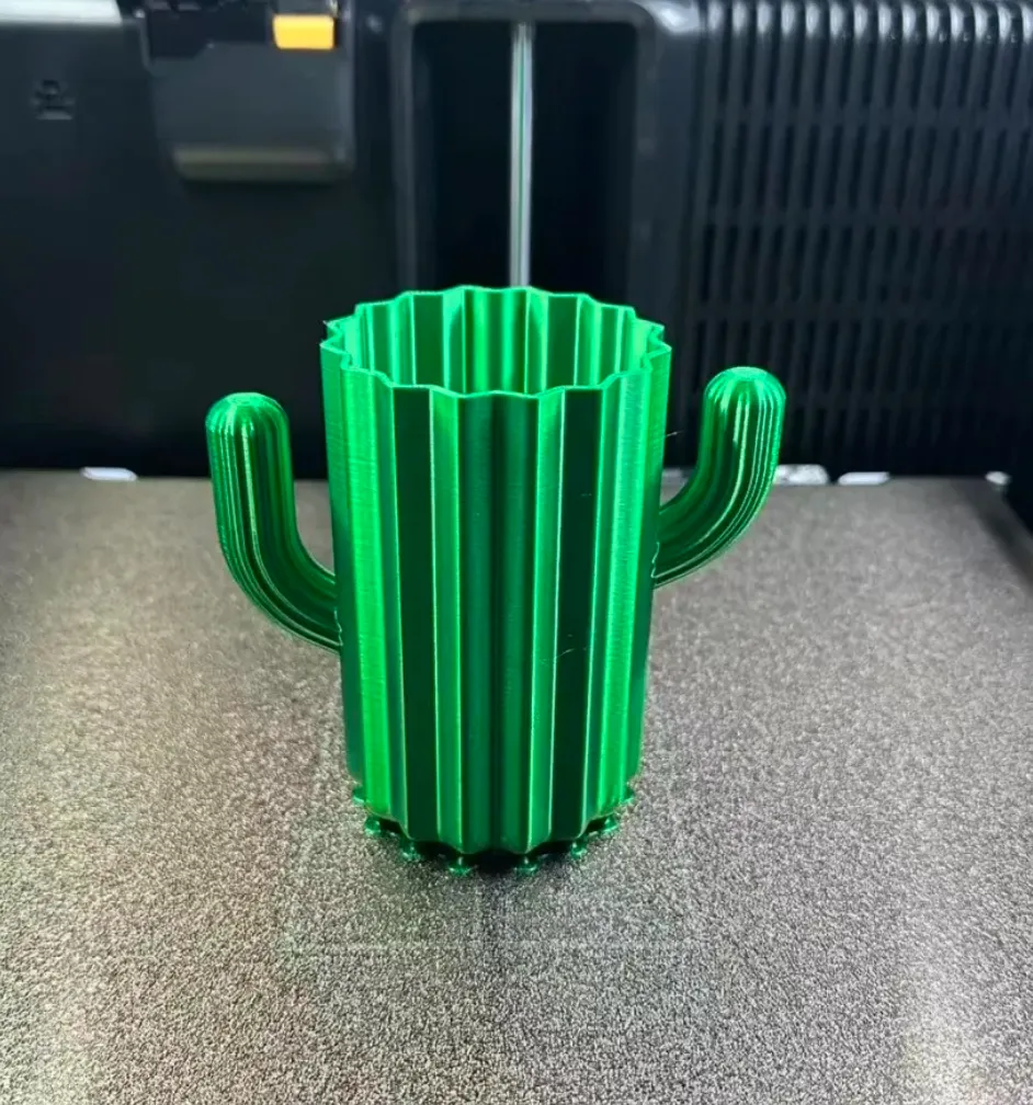 Cactus-shaped planter 3D printed with Bambu Lab PLA Silk+ Candy Green filament showing smooth glossy green surface
