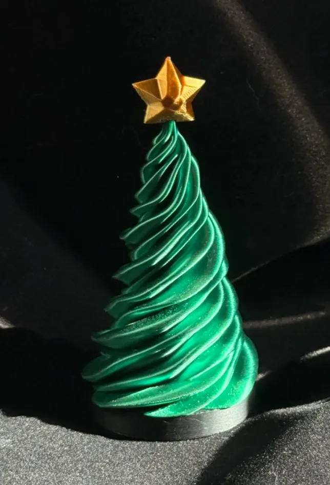 Spiral Christmas tree decoration 3D printed with Bambu Lab PLA Silk+ Candy Green filament 13506 featuring glossy silk finish