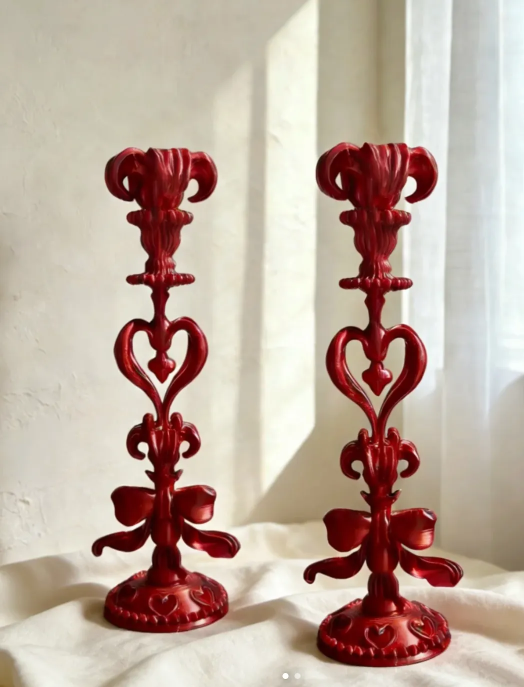 Ornate decorative candle holders 3D printed with Bambu Lab PLA Silk+ Candy Red filament 13205 featuring glossy silk finish