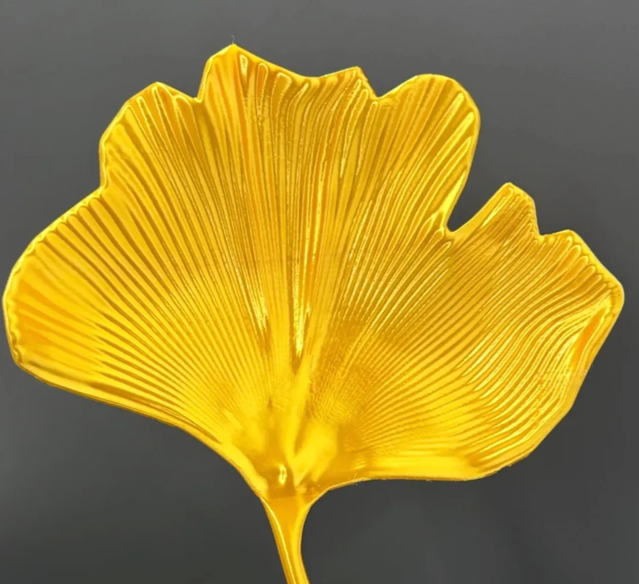 Ginkgo leaf decorative model printed with Bambu Lab PLA Silk+ Gold filament featuring smooth metallic sheen