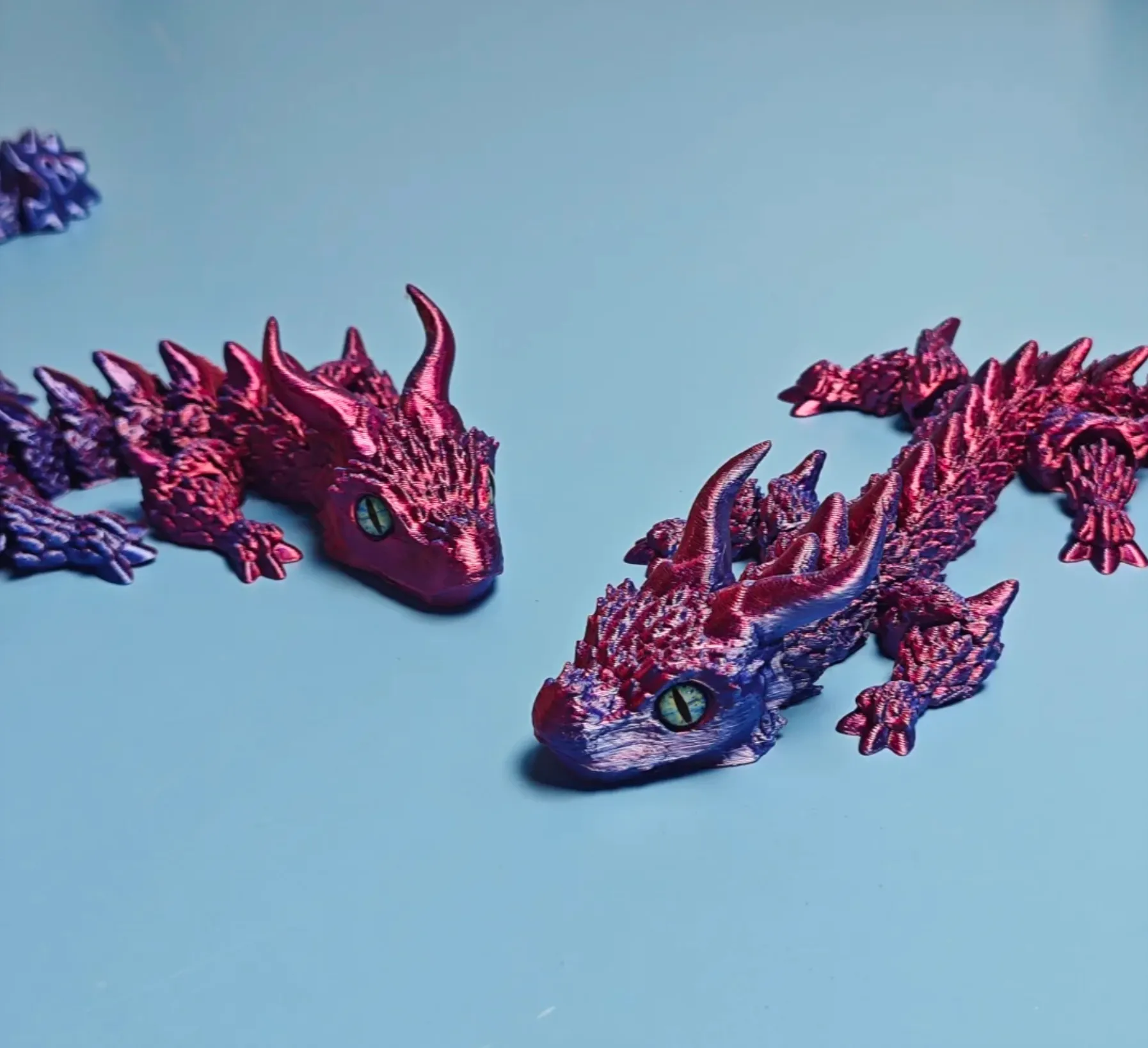 Dragon sculpture 3D printed with Bambu Lab PLA Silk Midnight Blaze Filament 13902, featuring metallic red and blue color shift with glossy silk surface