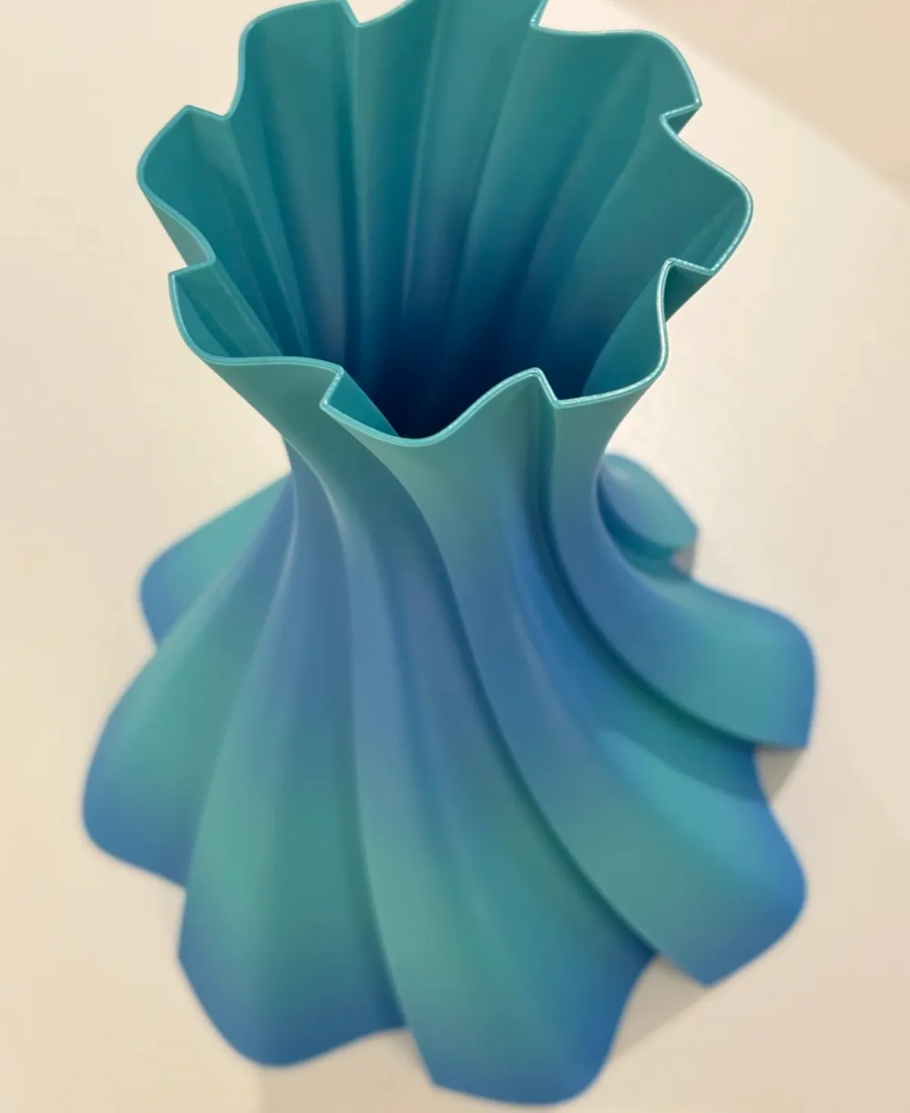 Spiral decorative vase 3D printed with Bambu Lab PLA Silk Multi Color Blue Hawaii Filament 13904, showing smooth blue and teal gradient with silk surface
