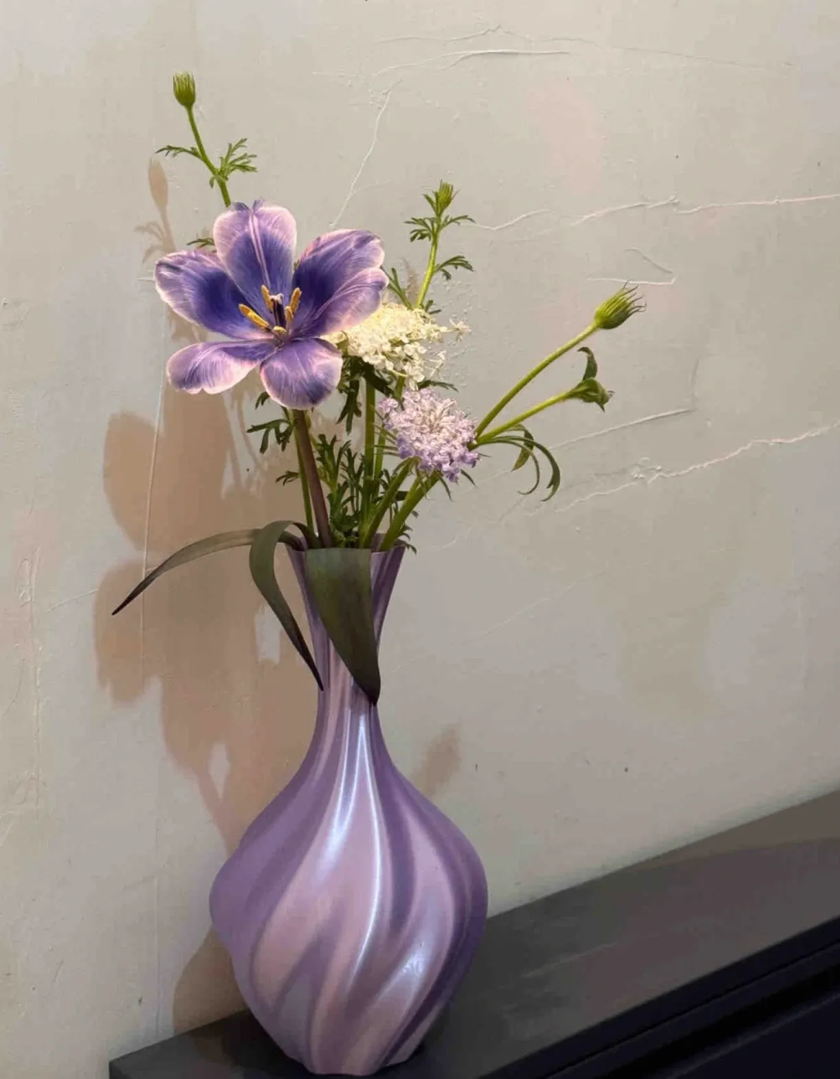 Handheld twisted vase printed with Bambu Lab PLA Silk+ Purple Filament 13702 showing smooth layers and metallic silk purple texture