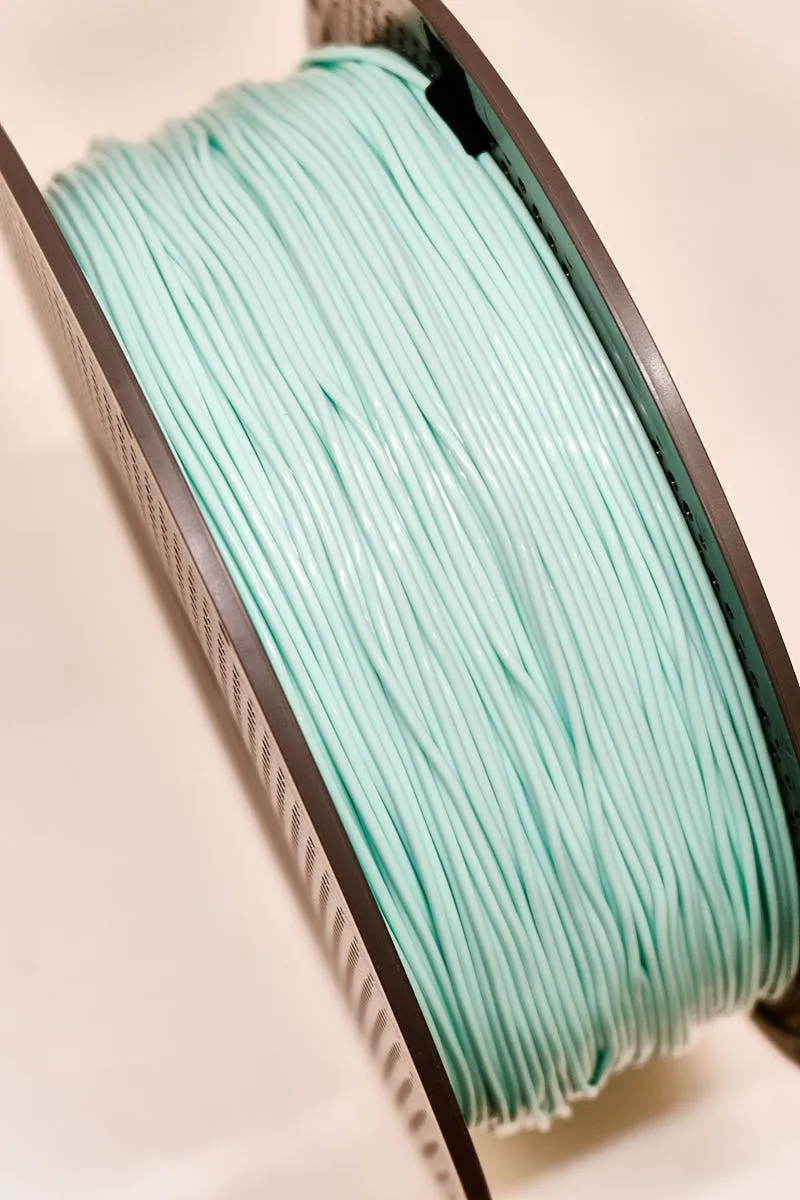 Light cyan TPU 85A filament tightly wound on Bambu Lab spool, flexible TPU material, Color Code 51500