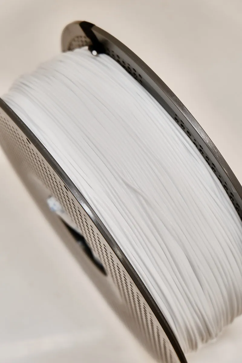 Close-up of white TPU 90A filament layers on spool under dark background, Bambu Lab Color Code 51105
