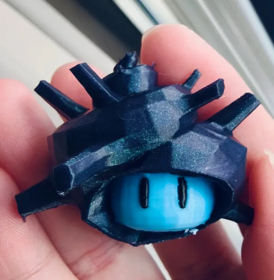 Close-up of a printed model using Bambu PLA Galaxy Nebulae filament 13504, displaying fine metallic sparkle, layered geometry, and deep galaxy blue tone