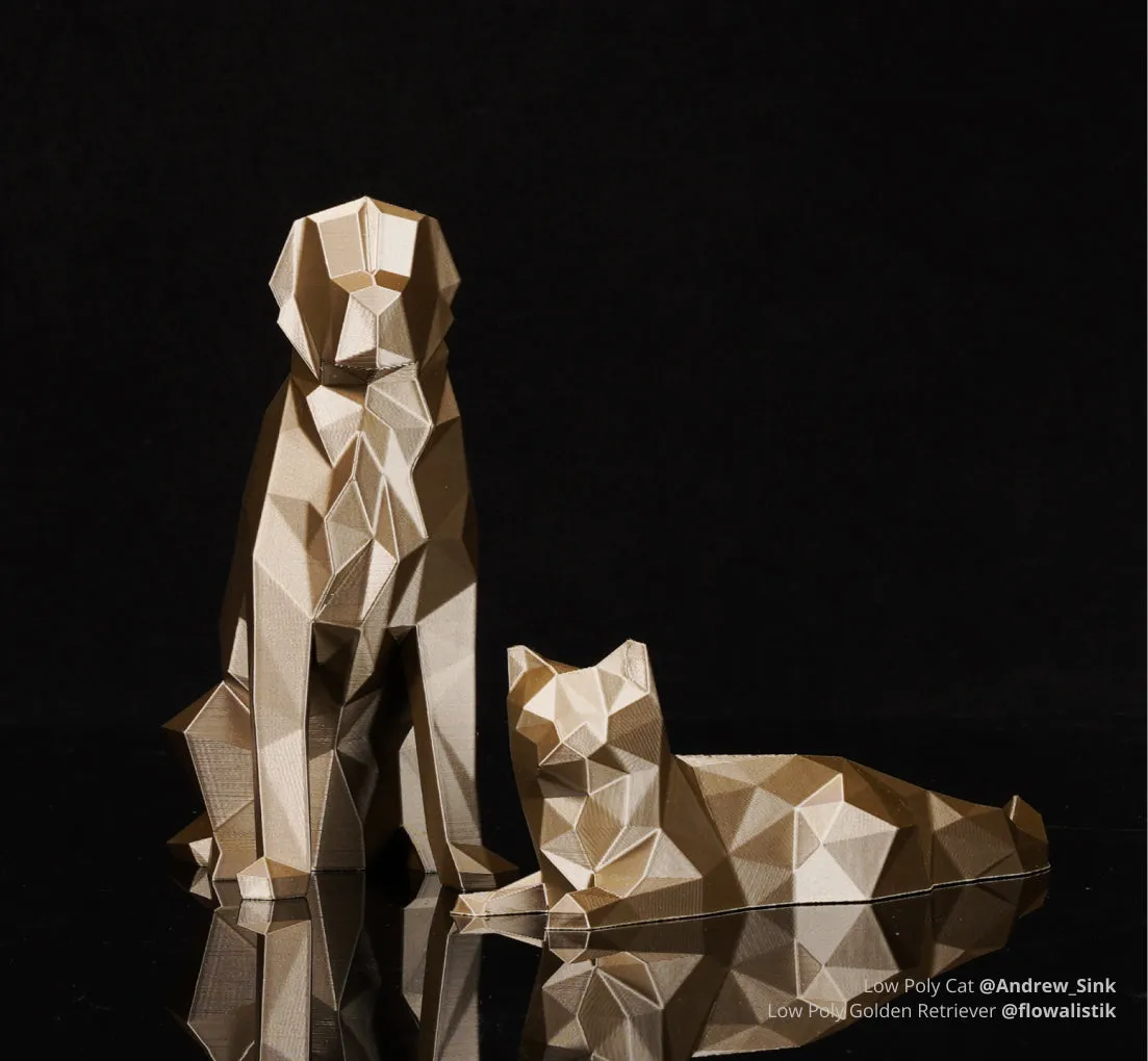 Low poly cat and dog models printed with Bambu PLA Metal filament, showing gold metallic surface and faceted geometry