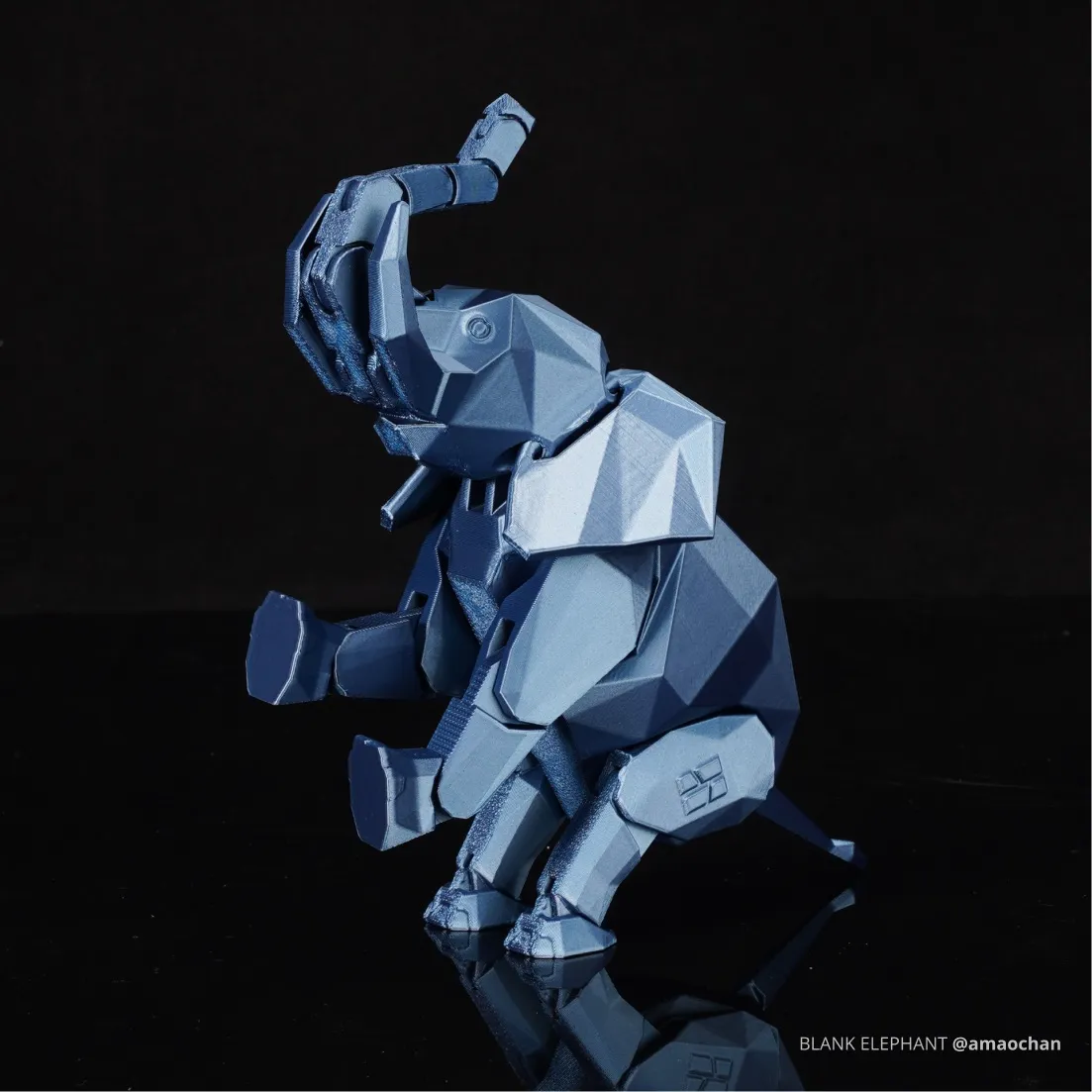 Low poly elephant figure printed with Bambu PLA Metal filament, featuring metallic blue surface texture and angular geometry