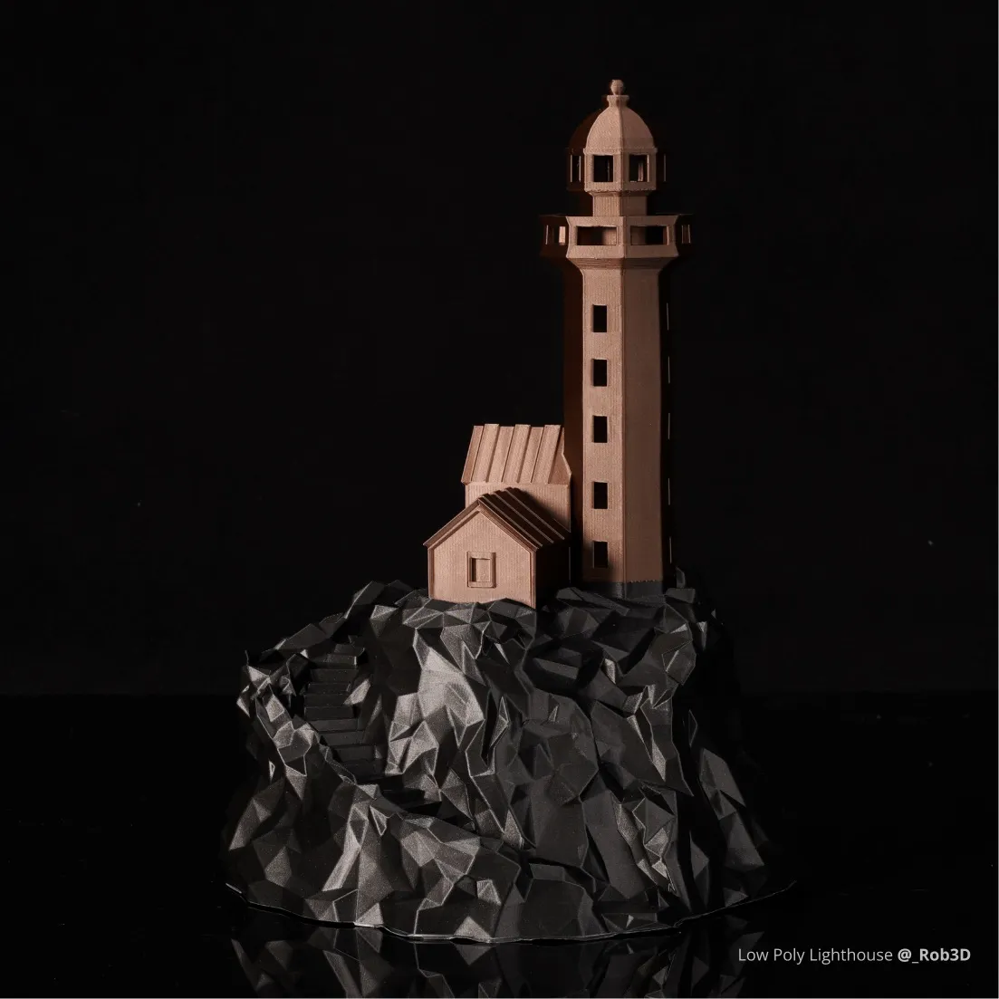 Low poly lighthouse model printed with Bambu PLA Metal filament, showing bronze metallic surface texture and sharp geometric details