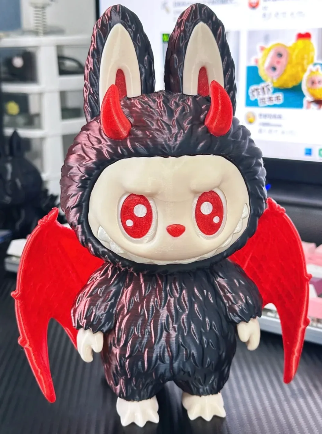 3D printed character figure made with Bambu PLA Silk Velvet Eclipse filament featuring velvet black-red gradient surface and glossy finish