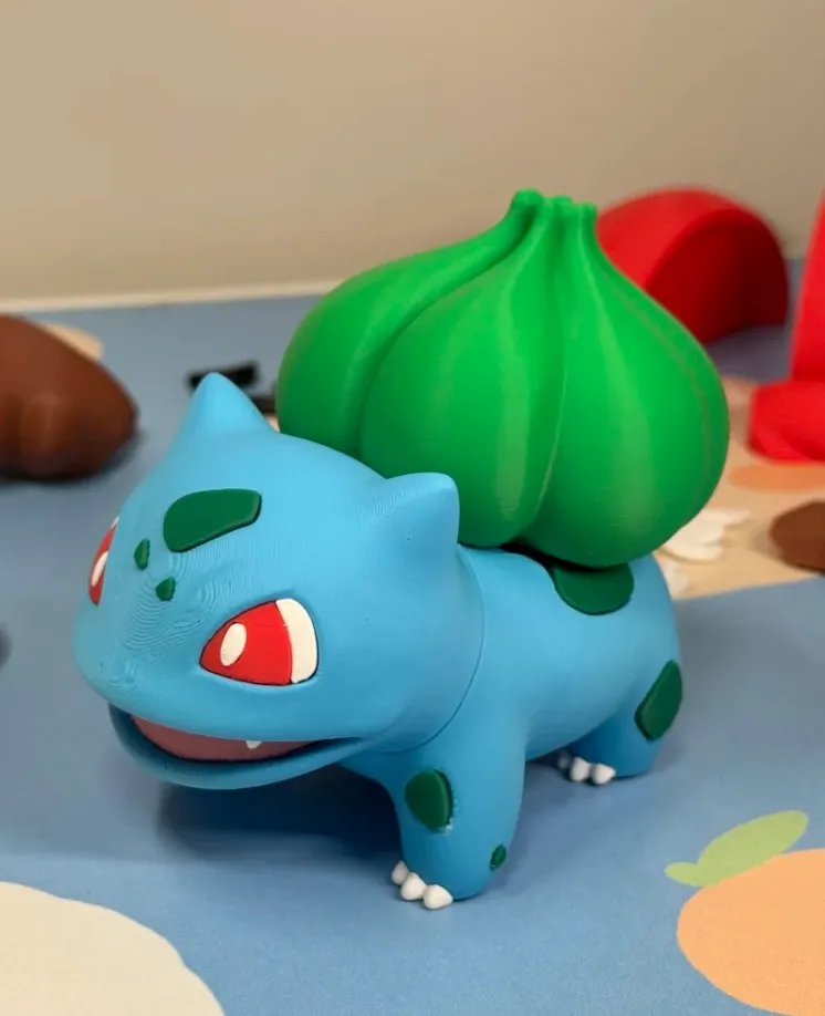 PLA Basic Mistletoe Green filament 3D printed green plant-shaped model with blue character figure