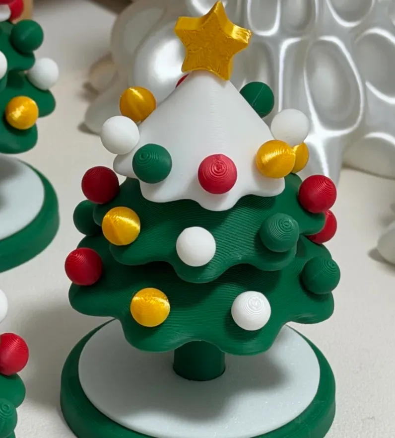 PLA Basic Mistletoe Green filament 3D printed green tree-shaped model with colorful round decorations