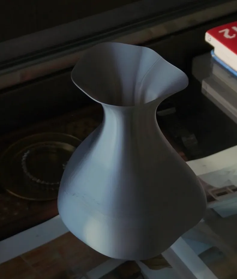PLA Basic Silver filament 3D printed silver vase-shaped model with smooth curved surface