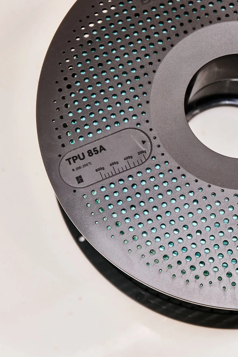 TPU 85A label and weight scale on Bambu Lab light cyan filament spool, Color Code 51500