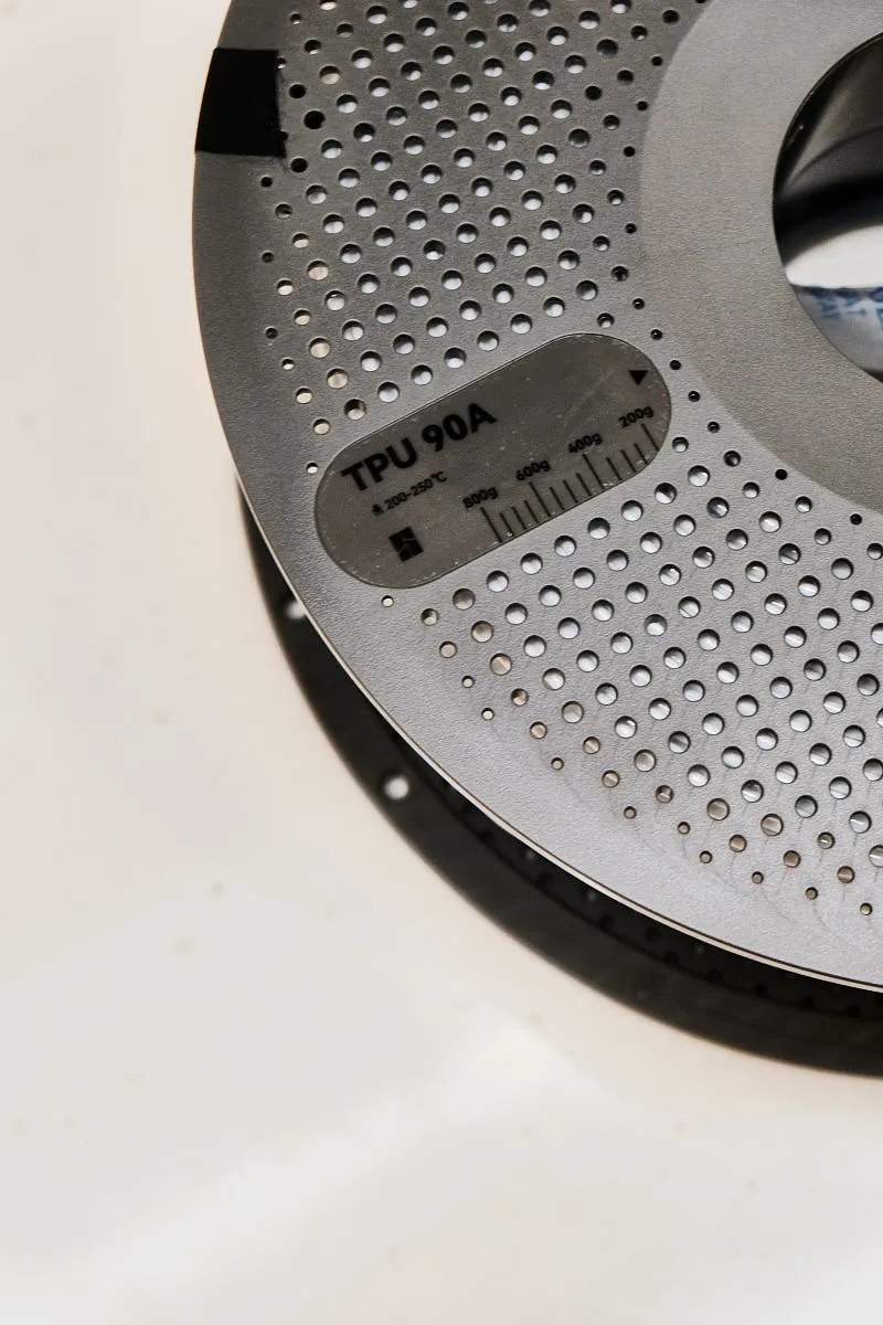 TPU 90A label with weight scale on Bambu Lab white filament spool, Color Code 51105