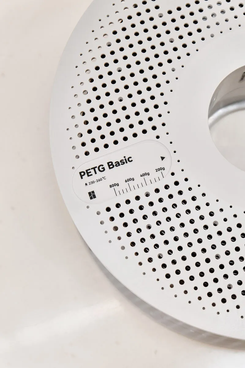 Close-up of PETG Basic label on Bambu Lab PETG Basic Brown filament spool 30800 with temperature information