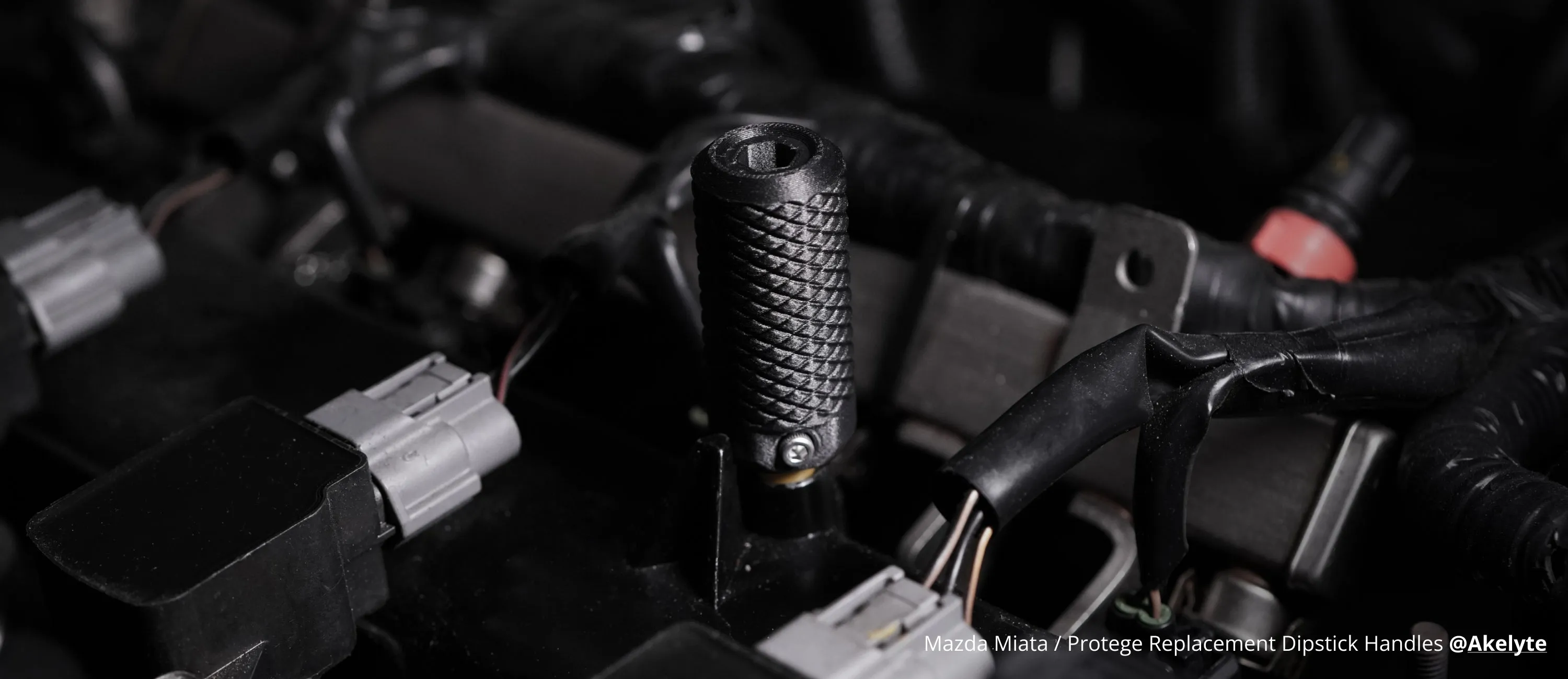 Automotive replacement dipstick handle 3D printed with Bambu Lab PETG-CF filament, featuring carbon fiber reinforced structure and heat-resistant surface