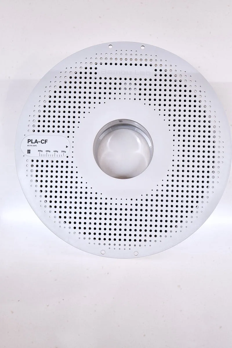 Top view of Bambu Lab PLA-CF Lava Gray filament spool with perforated design and evenly wound filament