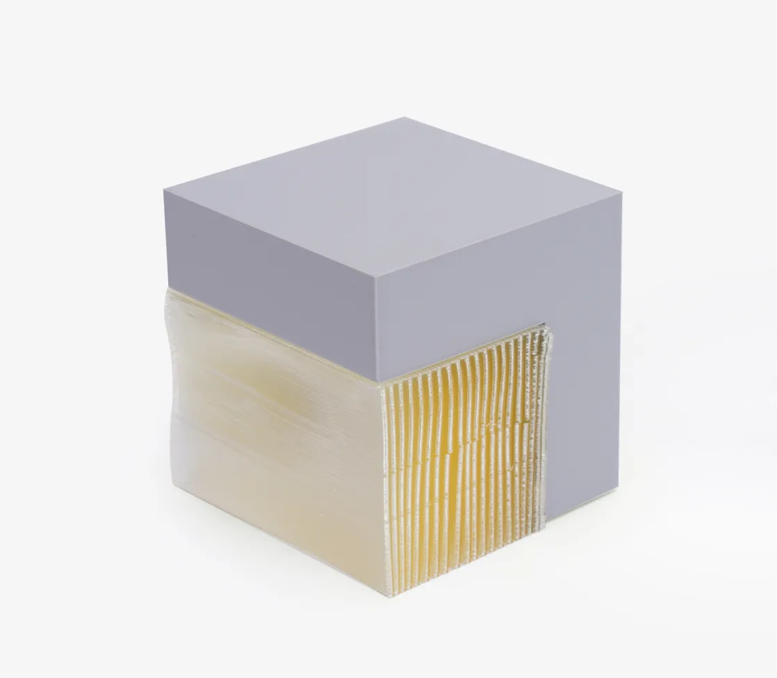 Close-up view of PVA water soluble support interface showing fine layer structure and smooth contact surface