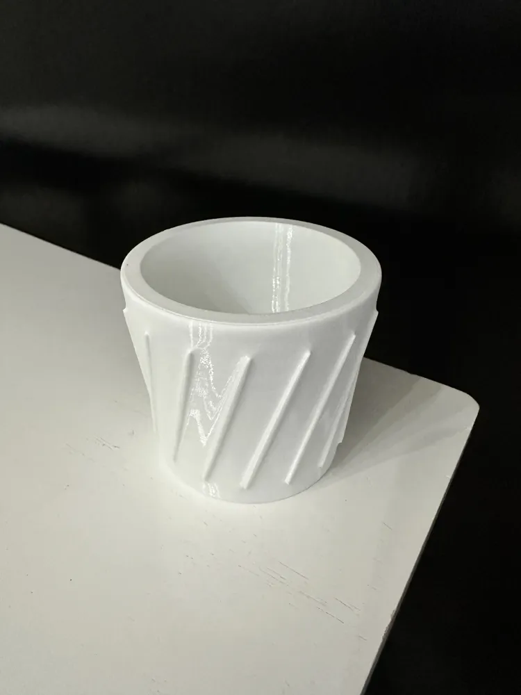 Cup-shaped part 3D printed with Bambu TPU 90A filament, demonstrating flexible walls, smooth surface finish, and consistent layer adhesion