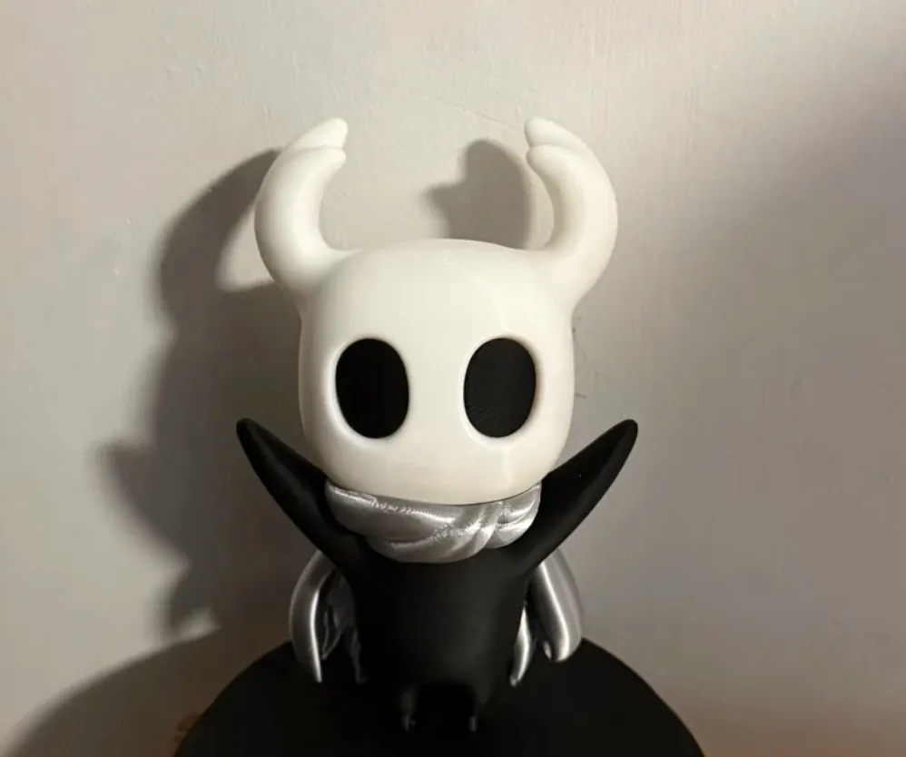 Close-up figurine with ivory white head printed using Bambu Lab PLA Matte Ivory White Filament with Spool Color Code 11100 showing smooth matte texture