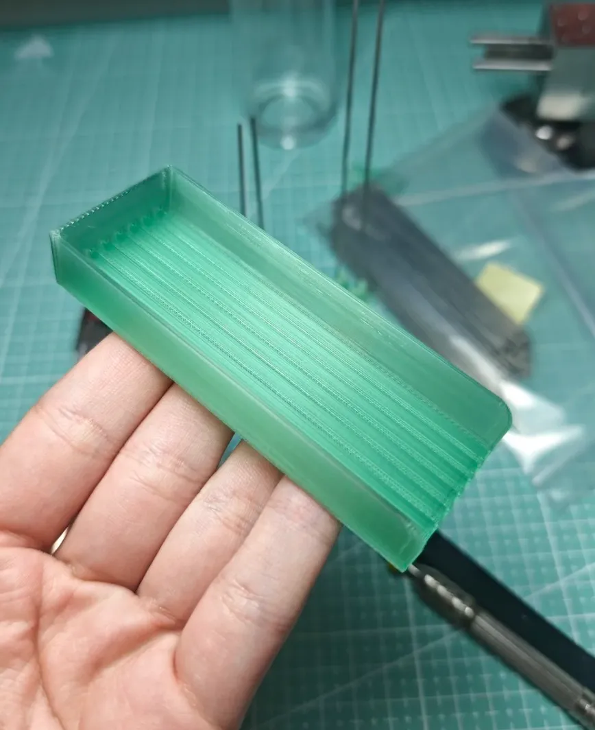 Functional test print made with Bambu Lab PLA Translucent Light Jade filament 13510 showing visible layer lines and structural clarity