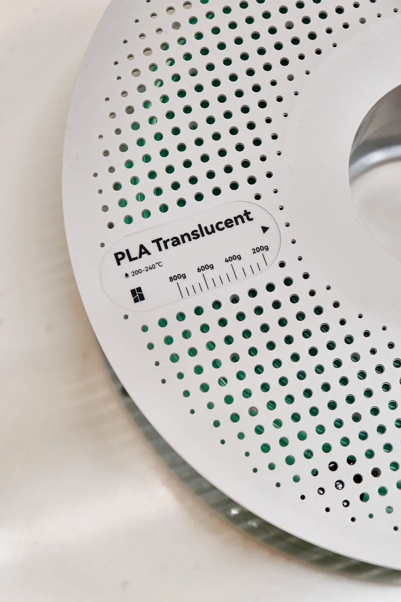 Spool label detail of Bambu Lab PLA Translucent Light Jade filament 13510 showing material type and recommended printing temperature