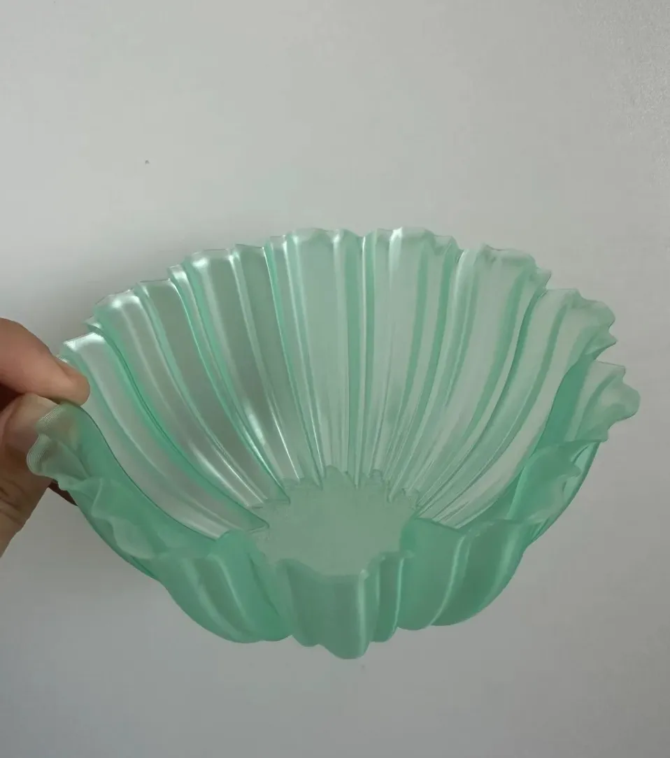 Handheld bowl-shaped model printed with Bambu Lab PLA Translucent Light Jade filament 13510, showing soft translucency and smooth surface